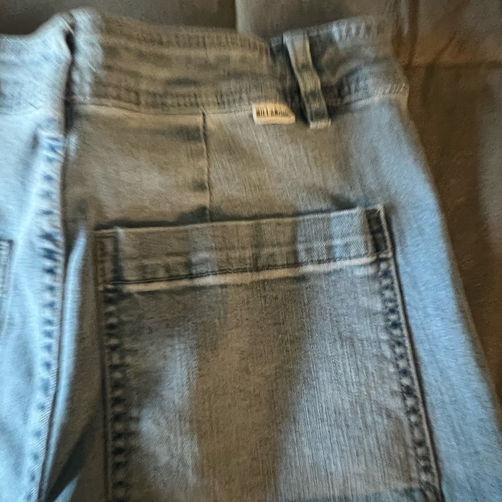 Light wash denim pants with frayed hem